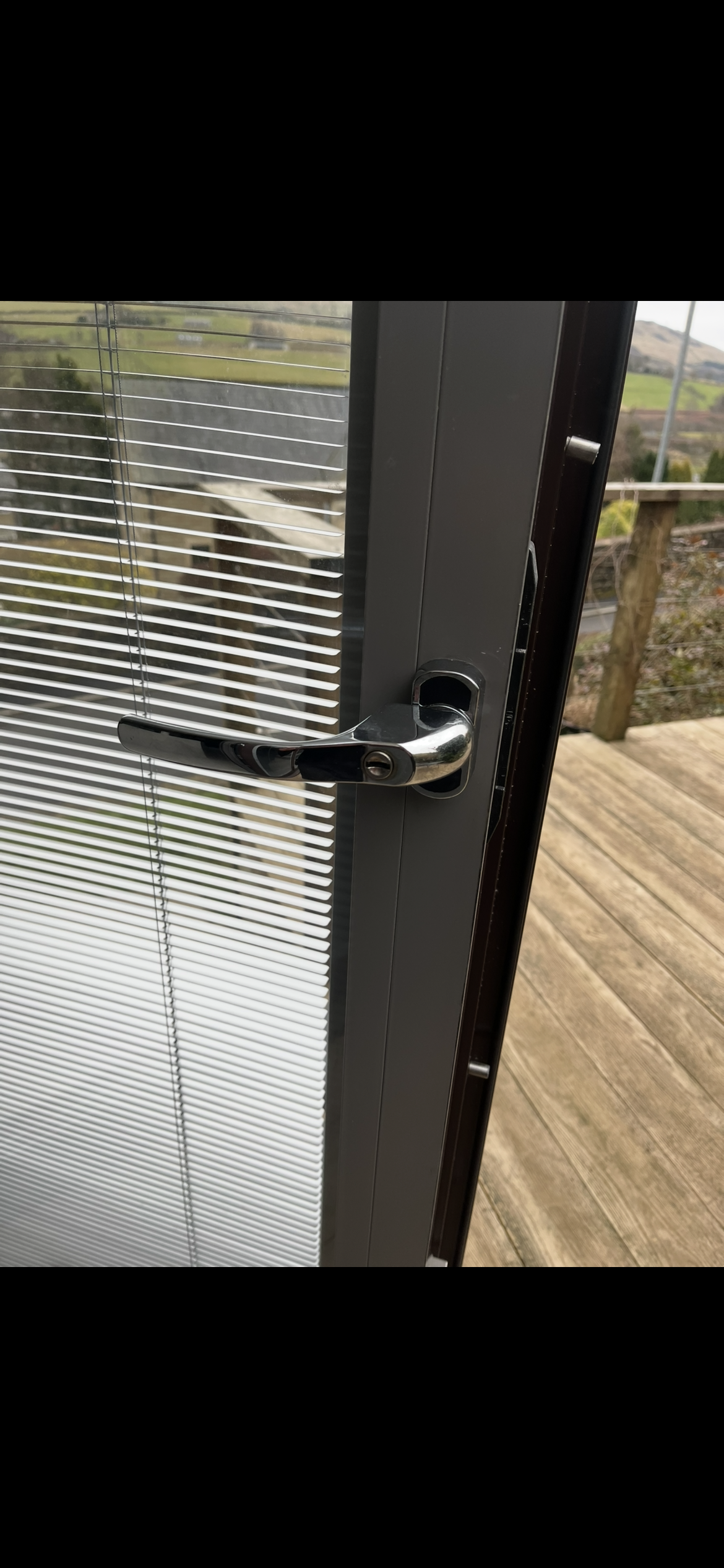 Aluminium door handle being repaired by engineer