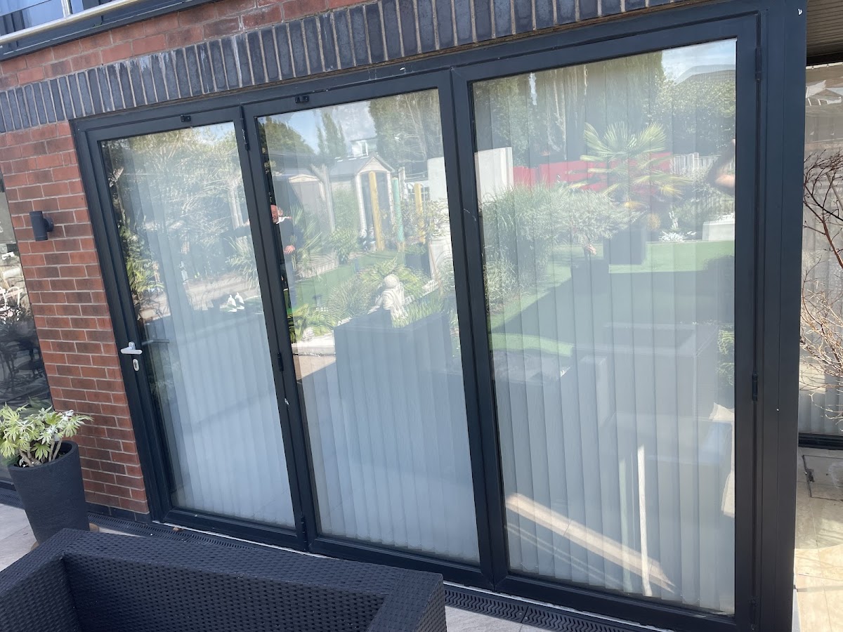 Black aluminium bifold doors exterior