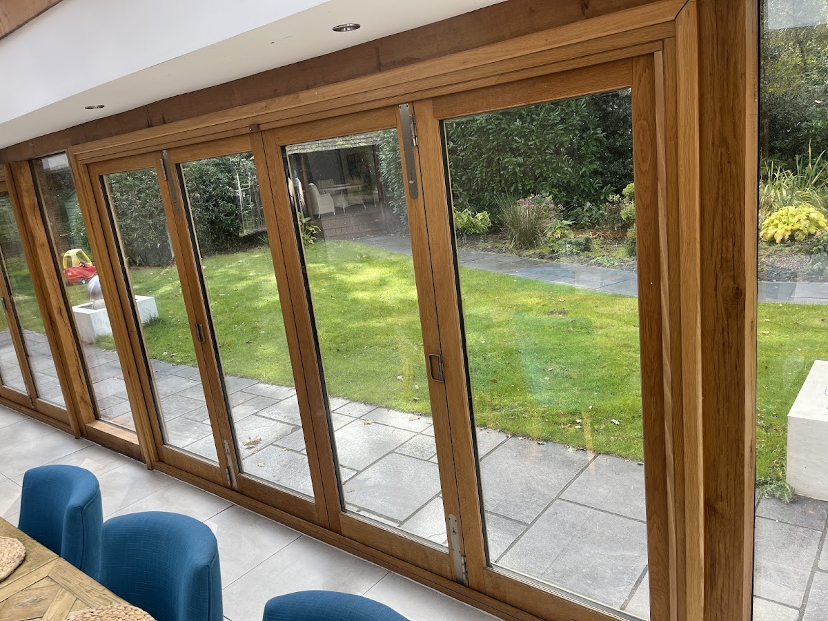 Interior view of bifold doors opening onto a garden, repaired by MA Door Repairs in Manchester