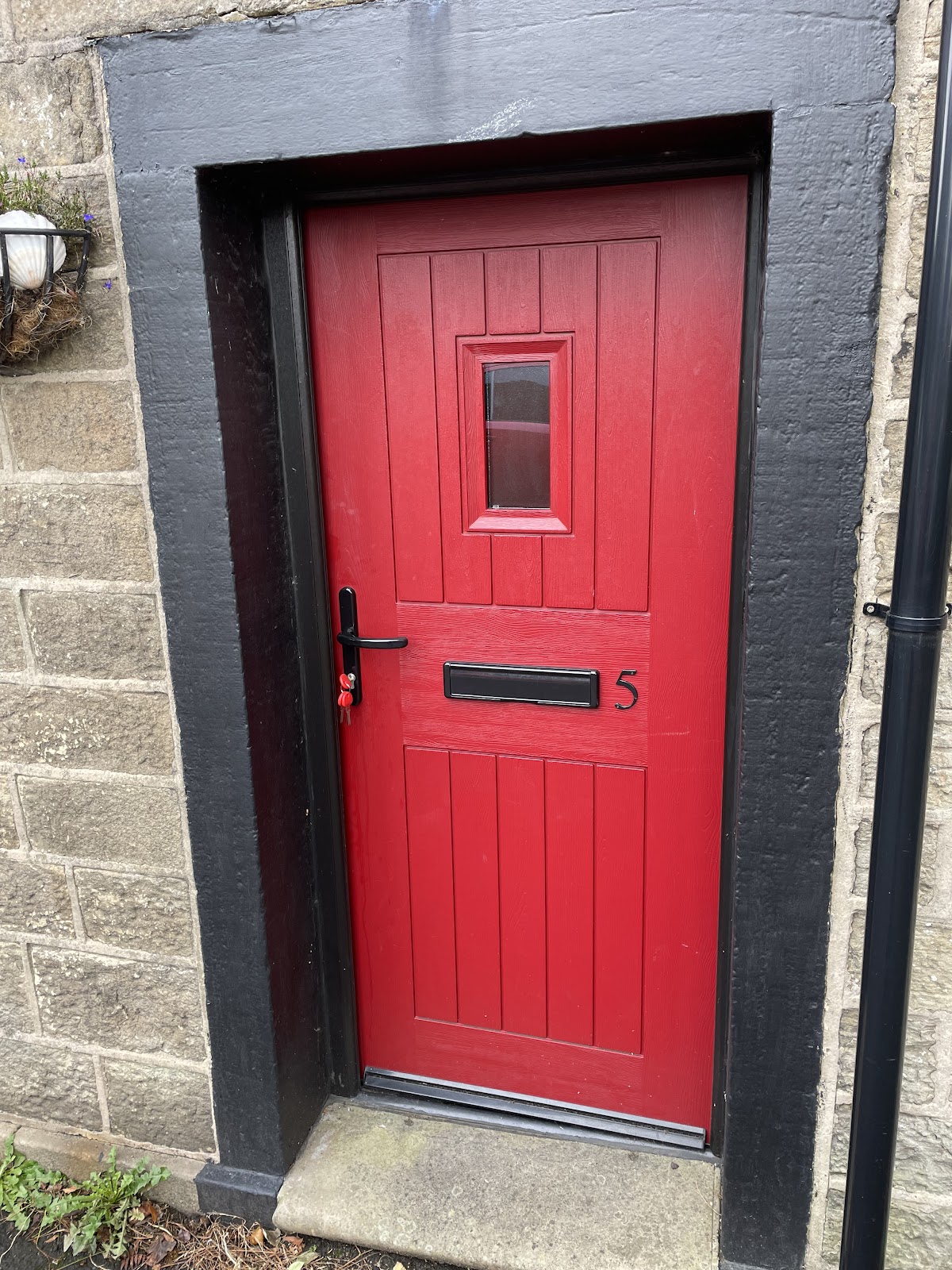 Red composite door repaired by MA Door Repairs