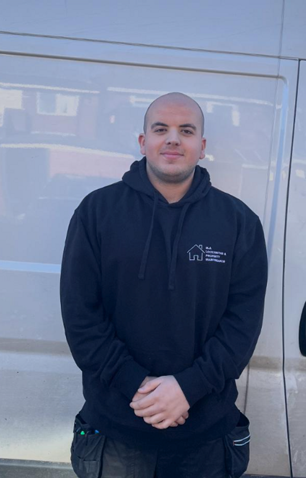 Mustafa from MA Door Repairs working on a door lock in Manchester