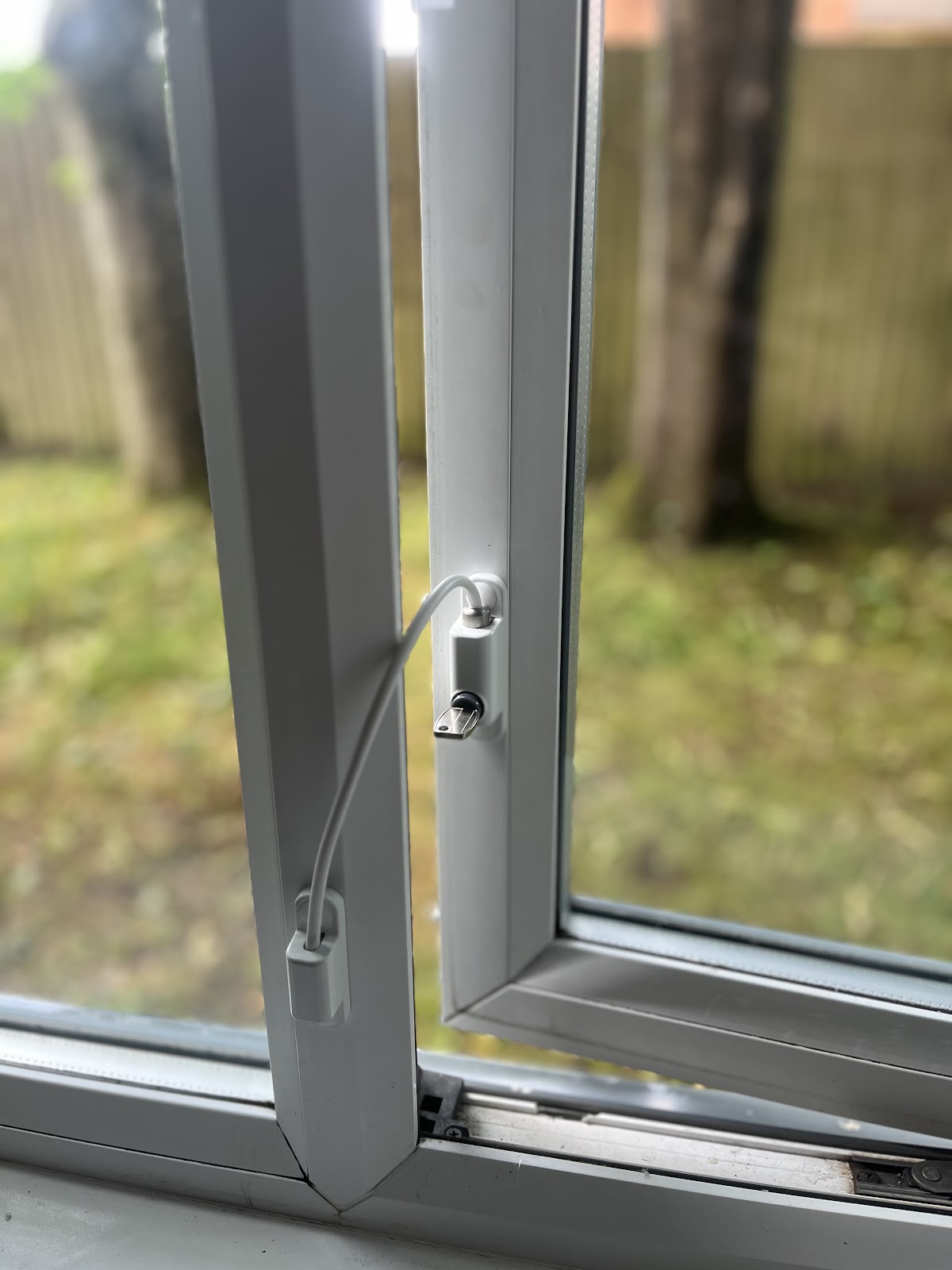 Window lock being assessed during security survey
