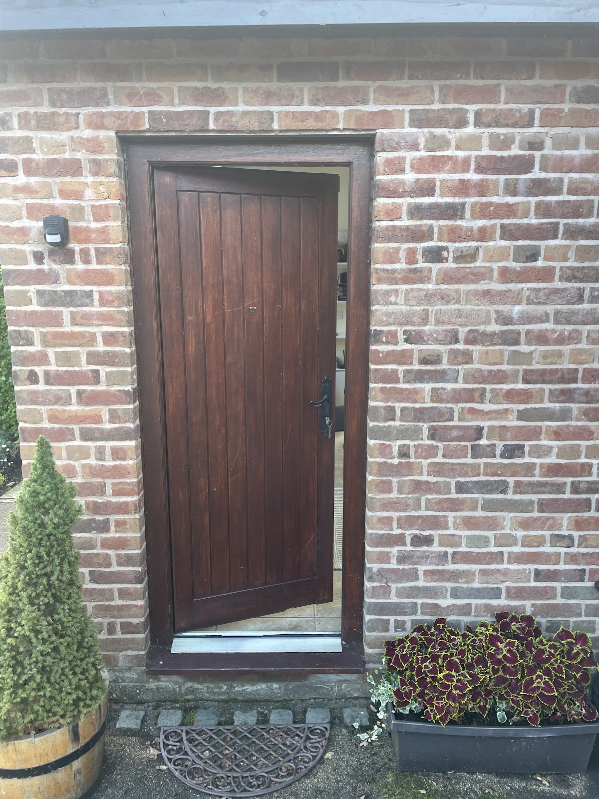 Repaired wooden side door with new ironmongery in Manchester